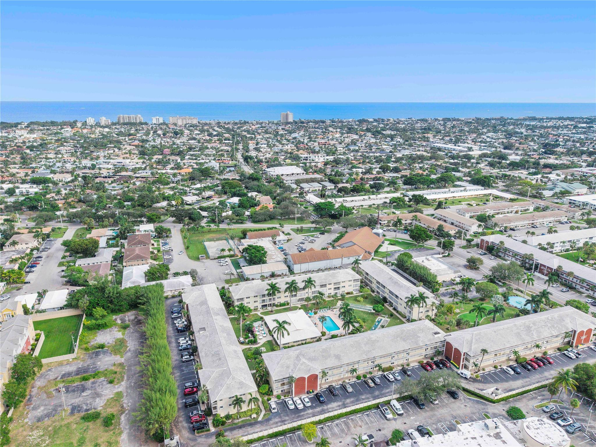 1951 Northeast 39th Street, Unit 156 Lighthouse Point, FL 33064 - Photo 40 of 43 an aerial view of a city