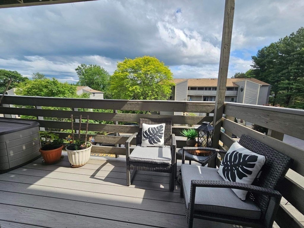 1195 Grafton Street, Unit 12 Worcester, MA 01604 - Photo 15 of 17 a view of a patio with couches chairs and a potted plant
