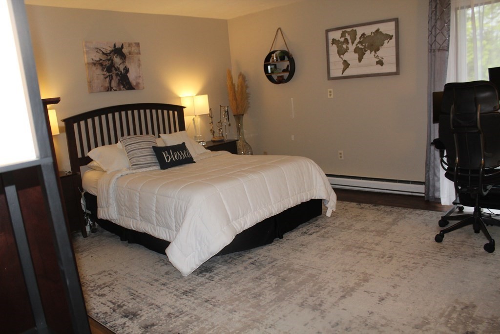 1195 Grafton Street, Unit 12 Worcester, MA 01604 - Photo 7 of 17 a bedroom with a bed and a window