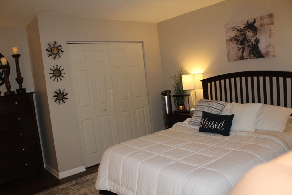 1195 Grafton Street, Unit 12 Worcester, MA 01604 - Photo 8 of 17 a bedroom with a bed and a table