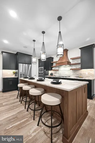a spacious bathroom with a sink double vanity and a tub