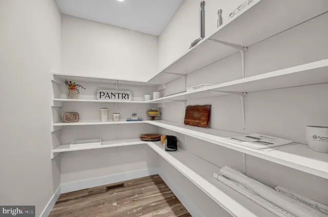 a living room with furniture and a large mirror