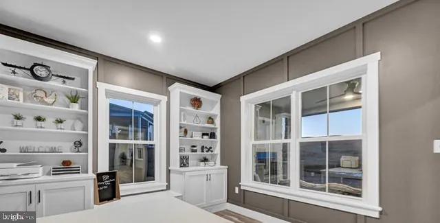 a bathroom with a granite countertop double vanity sink and a mirror