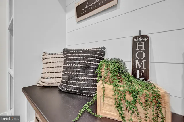 a bathroom with a granite countertop toilet sink and mirror