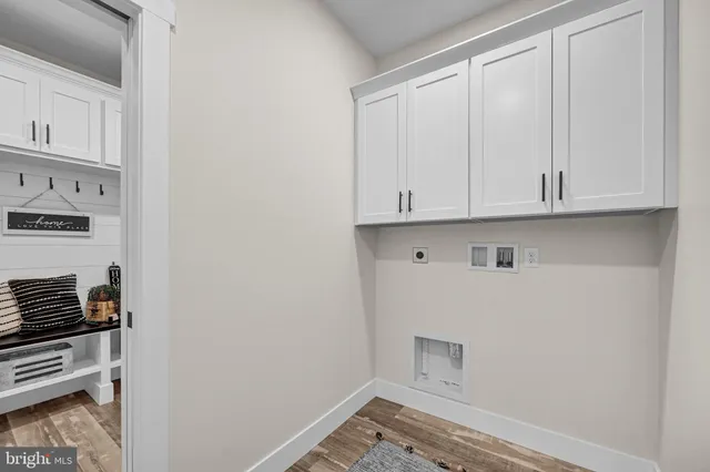 a living room with furniture a table and chairs