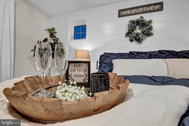 a balcony with furniture and a potted plant