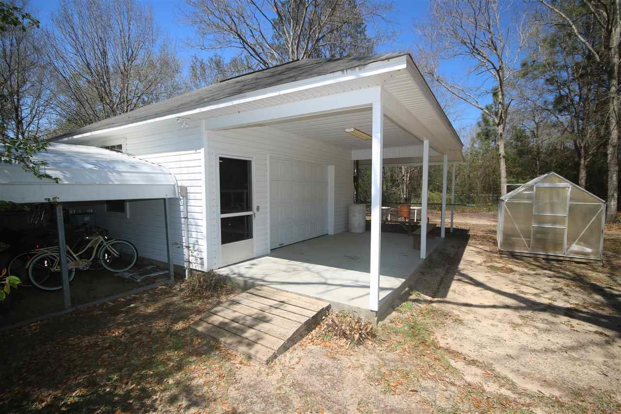 5337 Morgan Ridge Drive Milton, FL 32570 - Photo 43 of 50 w/roll up door, 2 windows & 21 x 10 covered porch.