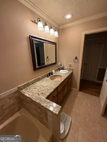 a bathroom with a sink a vanity and mirror