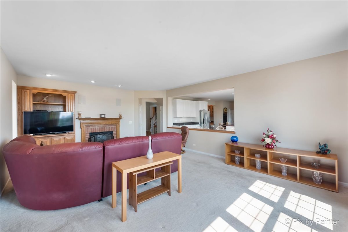 8475 Watson Circle Lakewood, IL 60014 - Photo 19 of 49 a living room with furniture a flat screen tv and a window