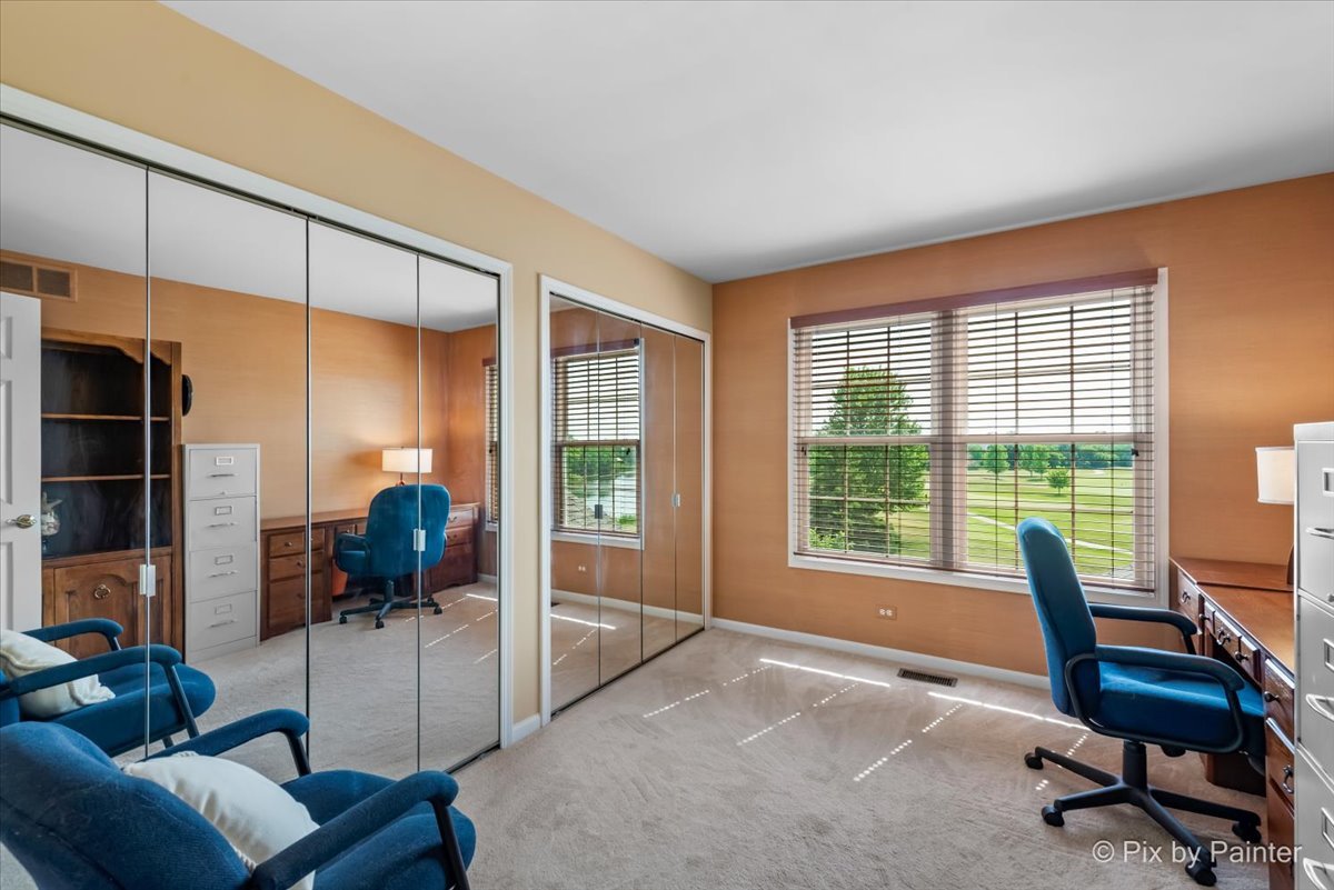 8475 Watson Circle Lakewood, IL 60014 - Photo 28 of 49 a living room with furniture and a floor to ceiling window