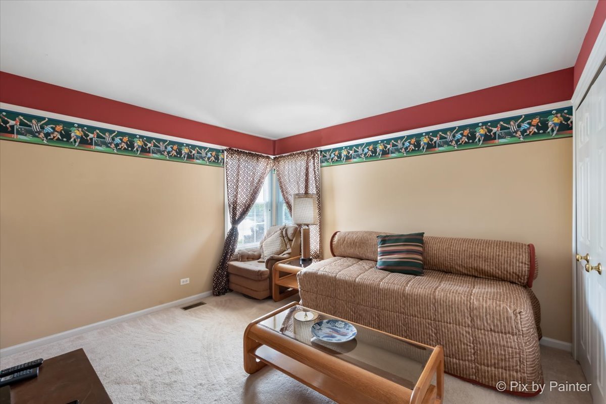 8475 Watson Circle Lakewood, IL 60014 - Photo 29 of 49 a bedroom with a bed and wooden floor