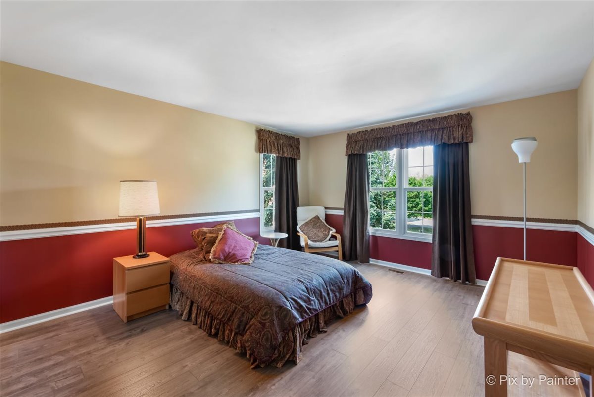 8475 Watson Circle Lakewood, IL 60014 - Photo 30 of 49 a bedroom with a bed and window