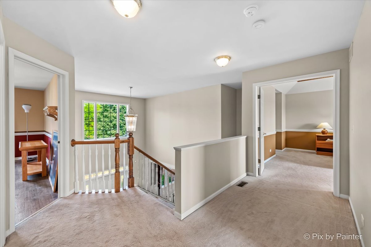 8475 Watson Circle Lakewood, IL 60014 - Photo 32 of 49 a view of a livingroom with furniture and staircase
