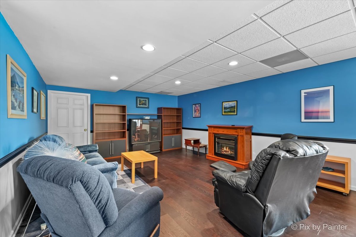 8475 Watson Circle Lakewood, IL 60014 - Photo 34 of 49 a living room with furniture and a flat screen tv