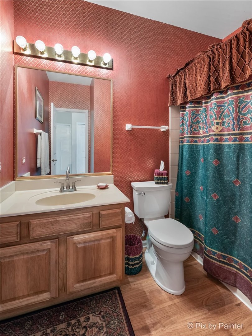8475 Watson Circle Lakewood, IL 60014 - Photo 38 of 49 a bathroom with a toilet sink and mirror