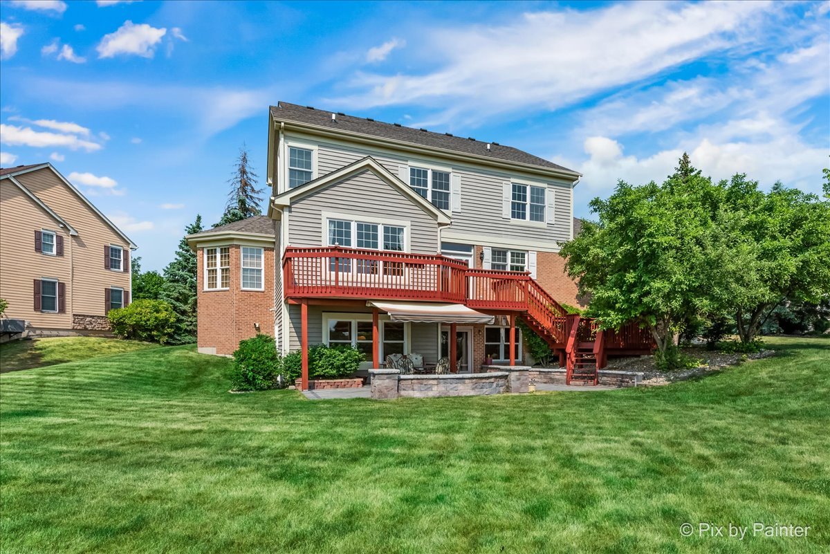 8475 Watson Circle Lakewood, IL 60014 - Photo 4 of 49 a front view of a house with a yard
