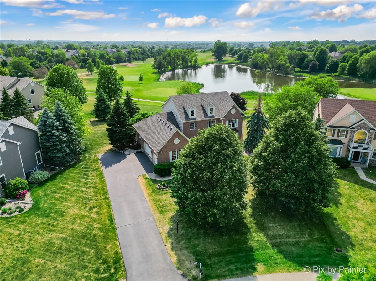 8475 Watson Circle Lakewood, IL 60014 - Photo 42 of 49 an aerial view of a house with garden space and outdoor seating