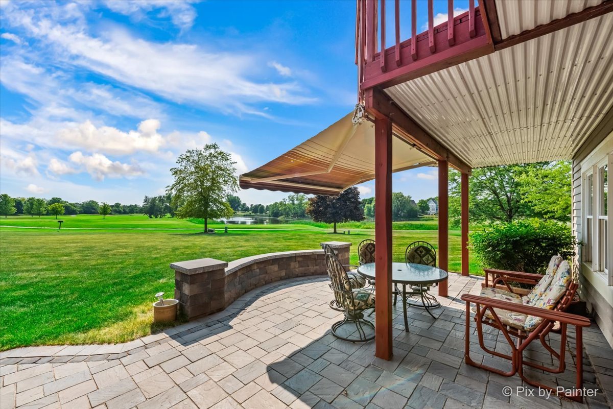 8475 Watson Circle Lakewood, IL 60014 - Photo 6 of 49 a view of a patio with a table chairs and backyard