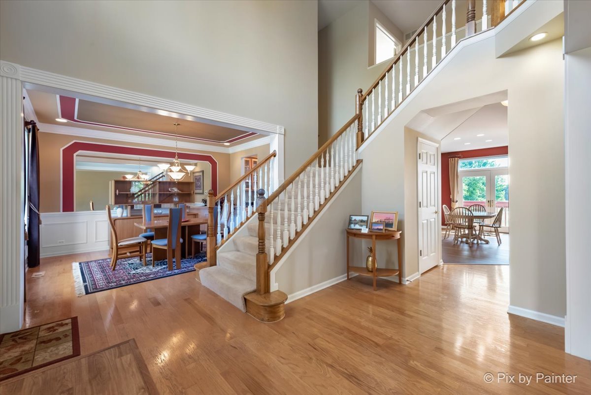 8475 Watson Circle Lakewood, IL 60014 - Photo 9 of 49 a view of entryway and hall with wooden floor