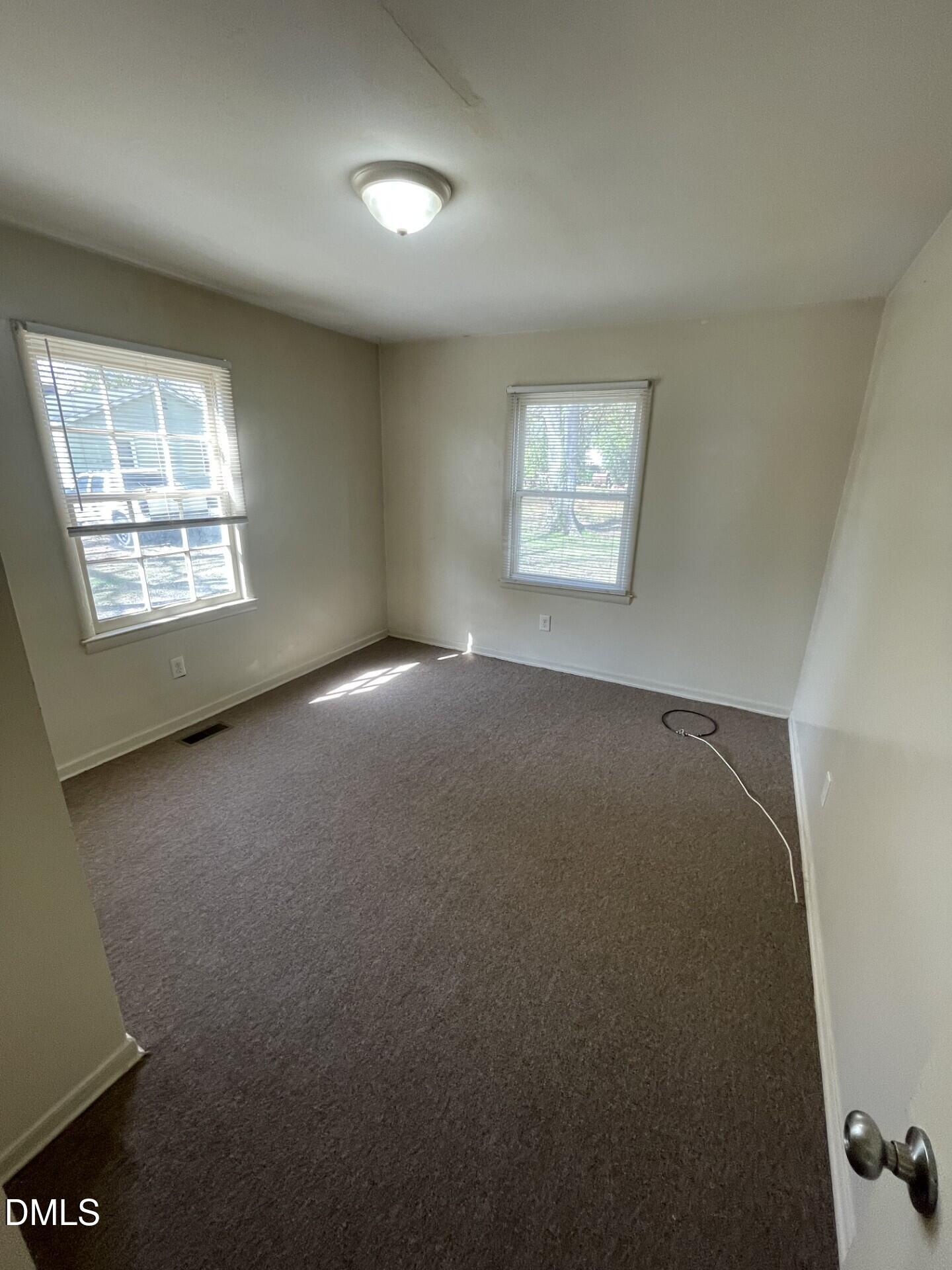 1007 Tipton Street Raleigh, NC 27610 - Photo 2 of 6 an empty room with a window