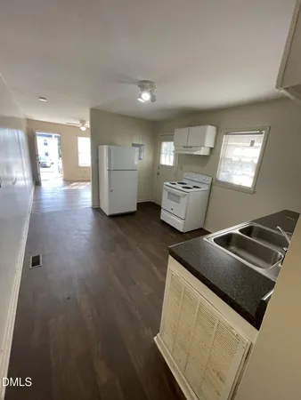 a view of an empty room and a window