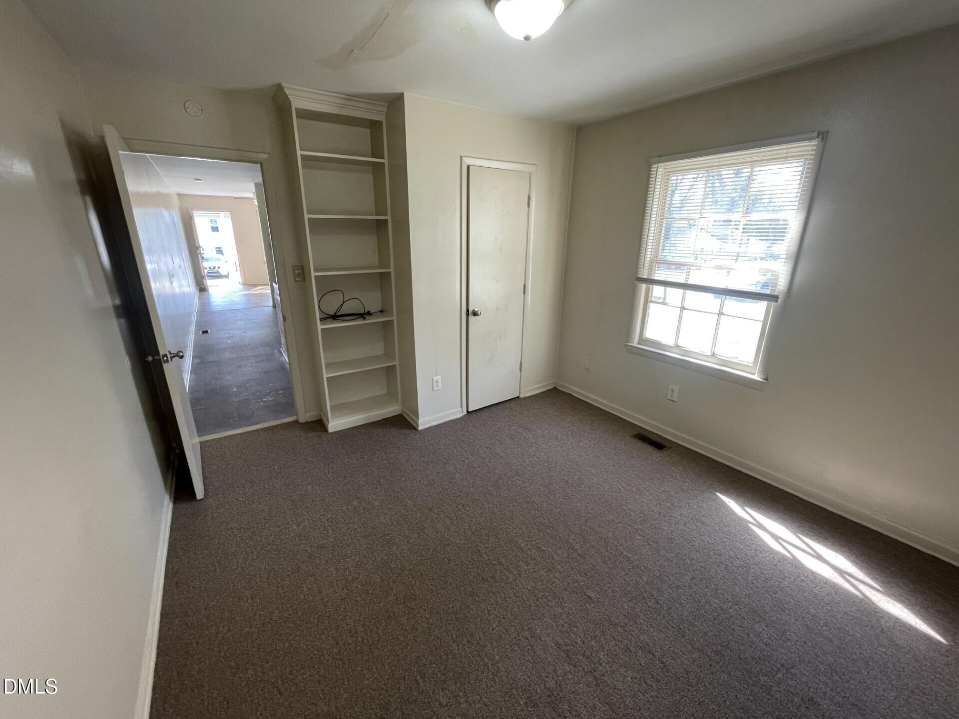 1007 Tipton Street Raleigh, NC 27610 - Photo 6 of 6 en empty room with windows and closet