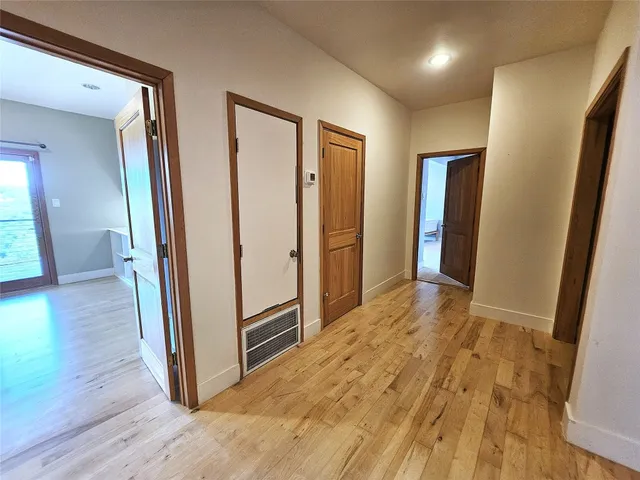 a view of livingroom with hardwood floor and hallway