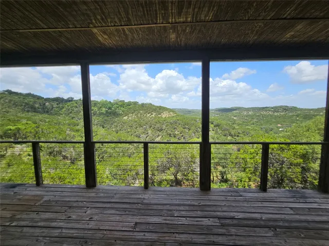 a view of porch with wooden floor in outdoor space