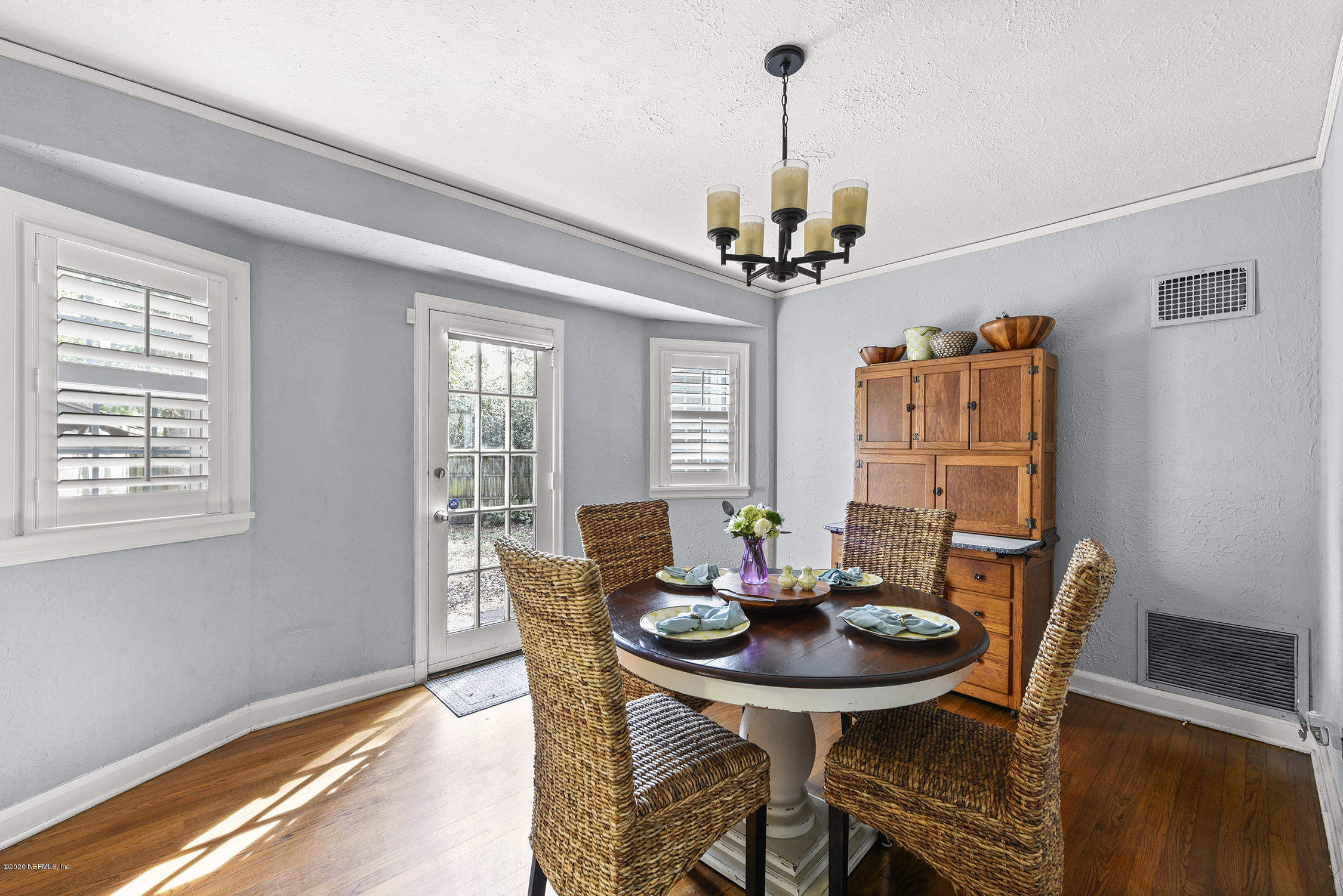 3847 Gadsden Road Jacksonville, FL 32207 - Photo 14 of 29 a view of a dining room with furniture window and wooden floor