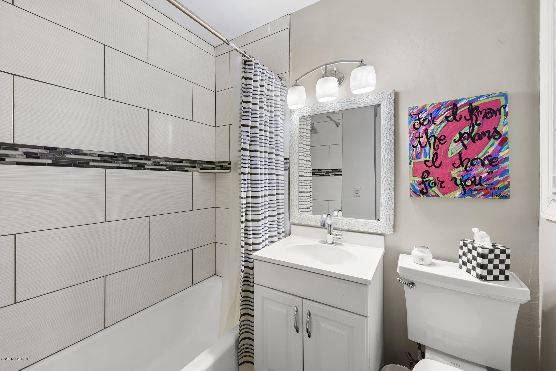 3847 Gadsden Road Jacksonville, FL 32207 - Photo 18 of 29 a bathroom with a sink a vanity and a mirror