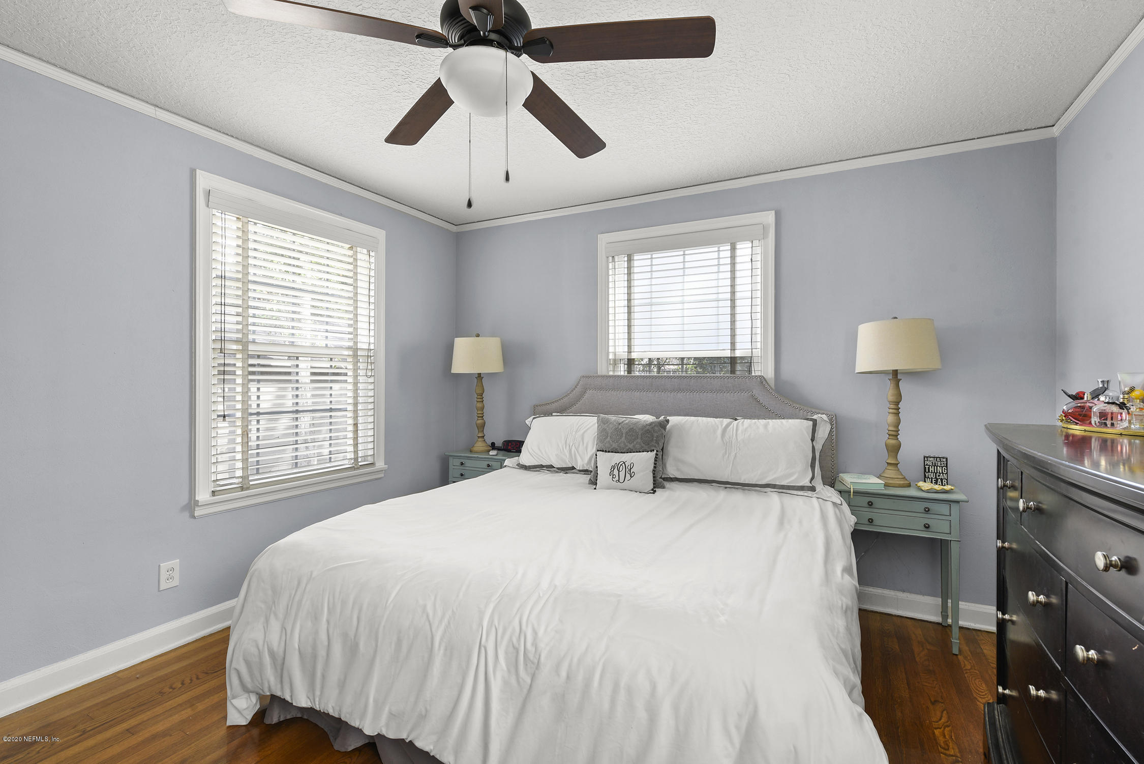 3847 Gadsden Road Jacksonville, FL 32207 - Photo 27 of 29 a bedroom with a bed and wooden floor