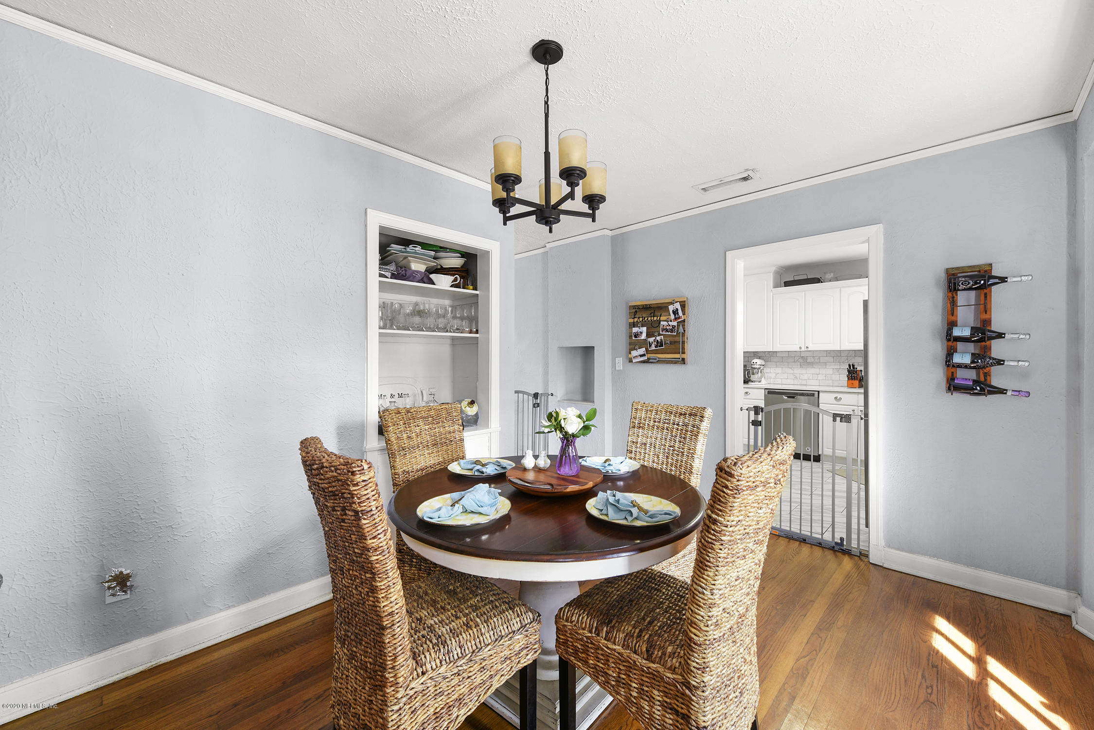 3847 Gadsden Road Jacksonville, FL 32207 - Photo 28 of 29 a view of a dining room with furniture window and wooden floor