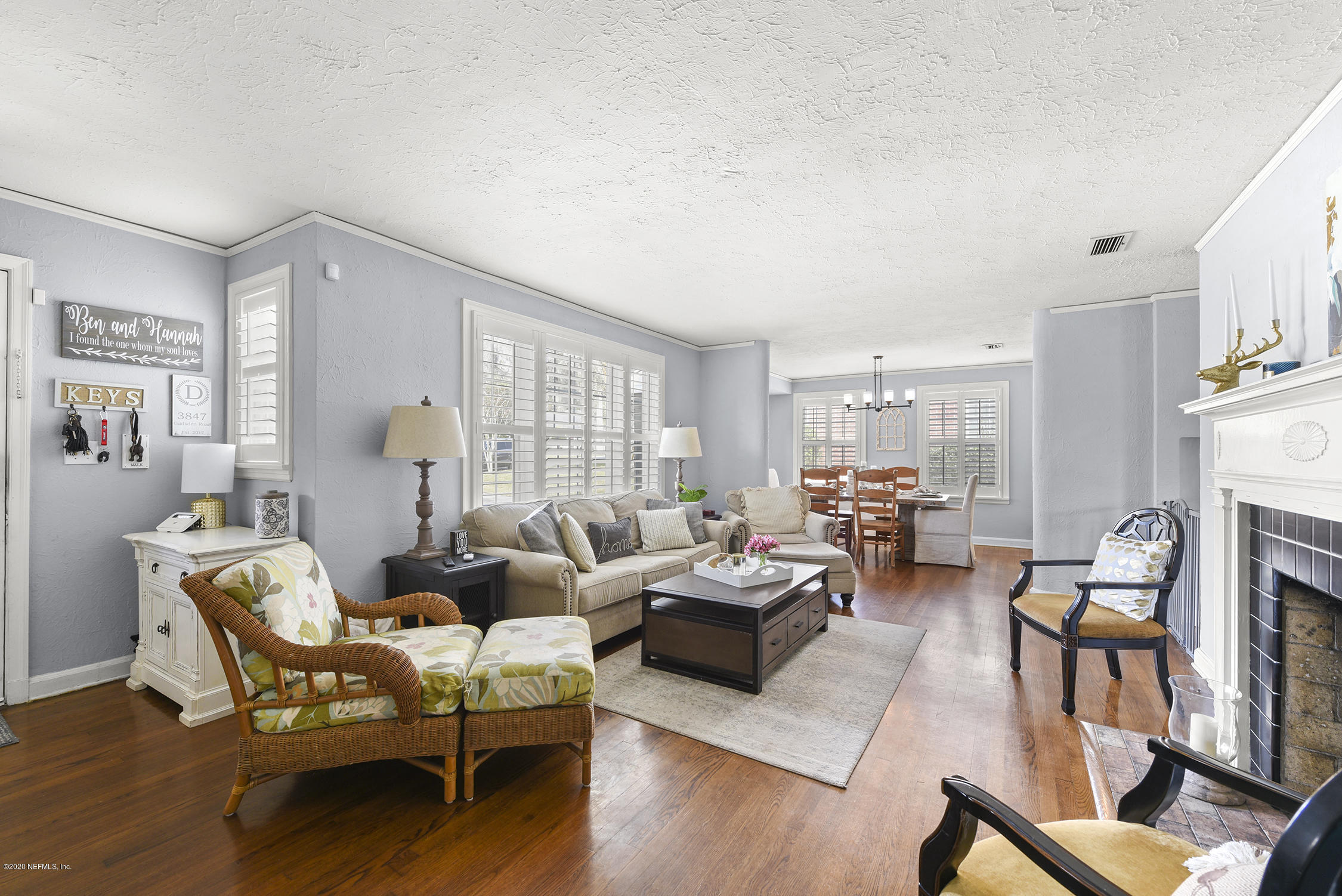 3847 Gadsden Road Jacksonville, FL 32207 - Photo 5 of 29 a living room with furniture fireplace and a large window