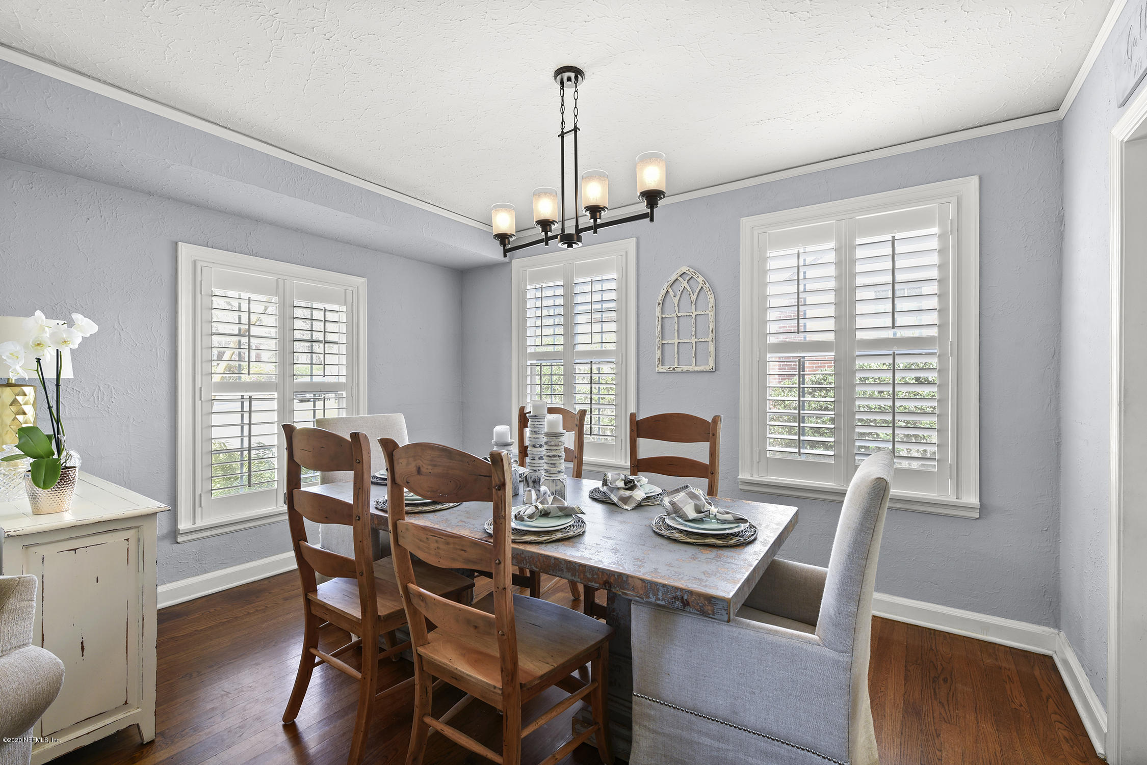 3847 Gadsden Road Jacksonville, FL 32207 - Photo 8 of 29 a view of a dining room with furniture window and wooden floor