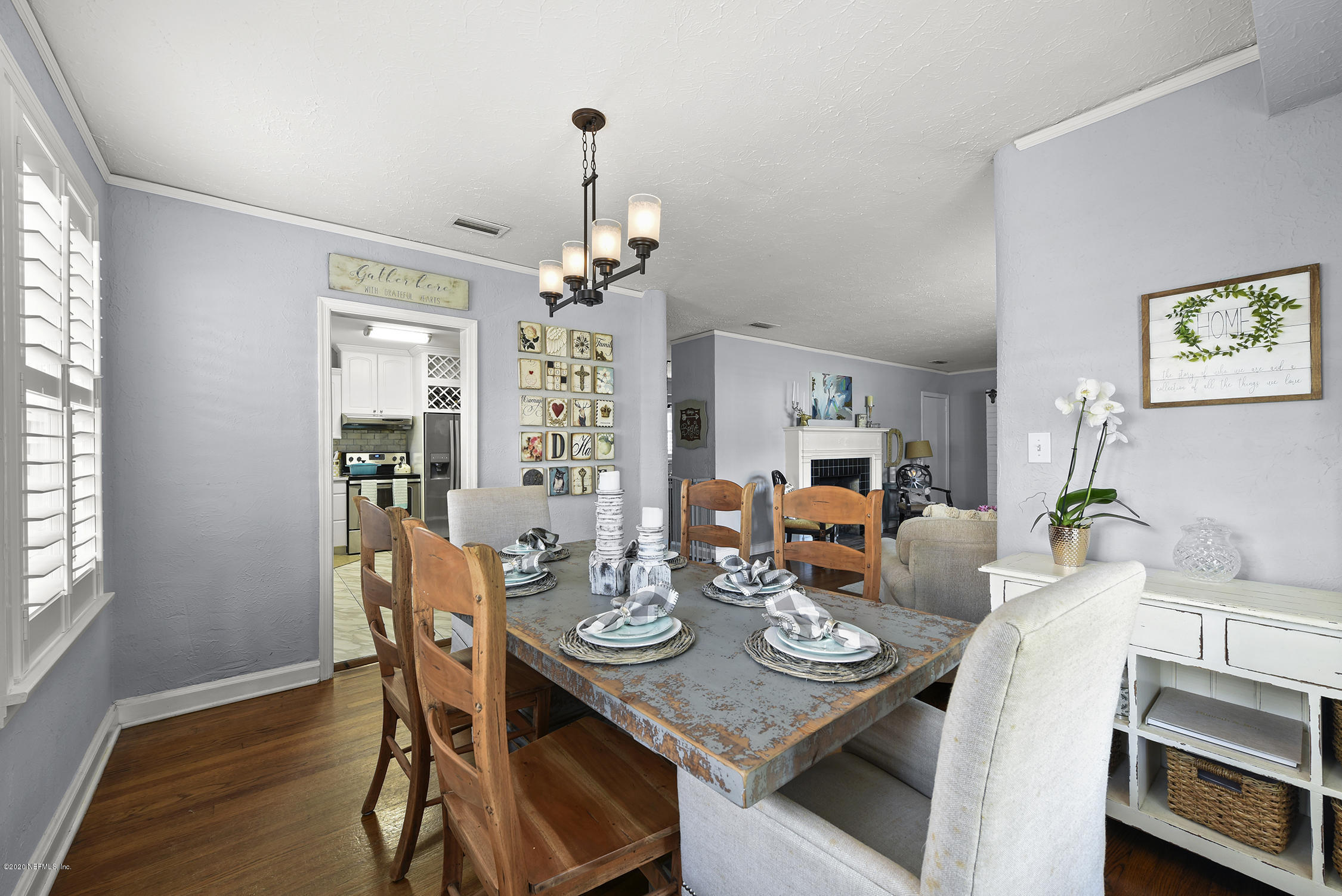 3847 Gadsden Road Jacksonville, FL 32207 - Photo 10 of 29 a view of a dining room with furniture and wooden floor