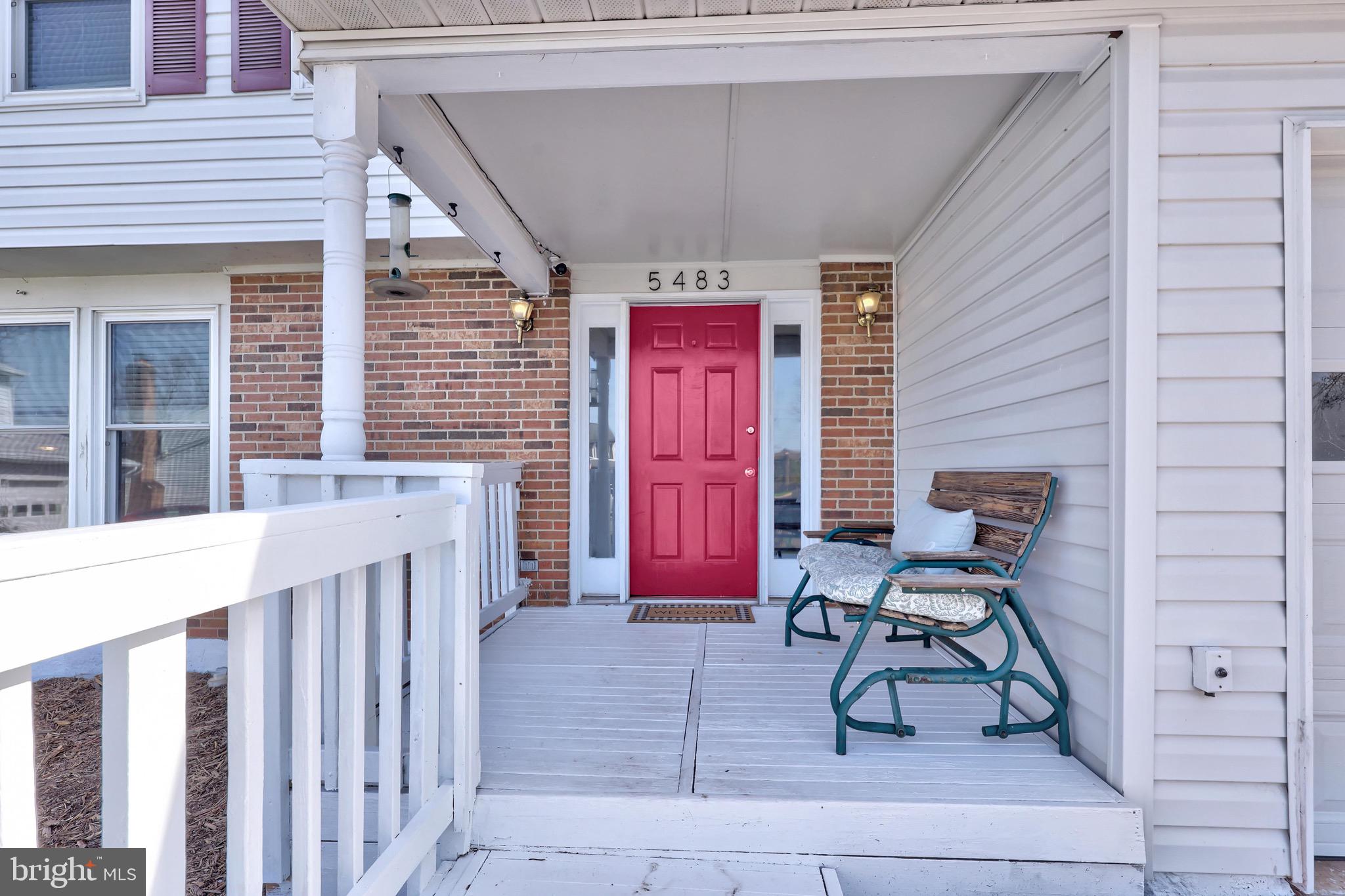 5483 Braddock Ridge Drive Centreville, VA 20120 - Photo 1 of 1 a building outdoor space with a bench