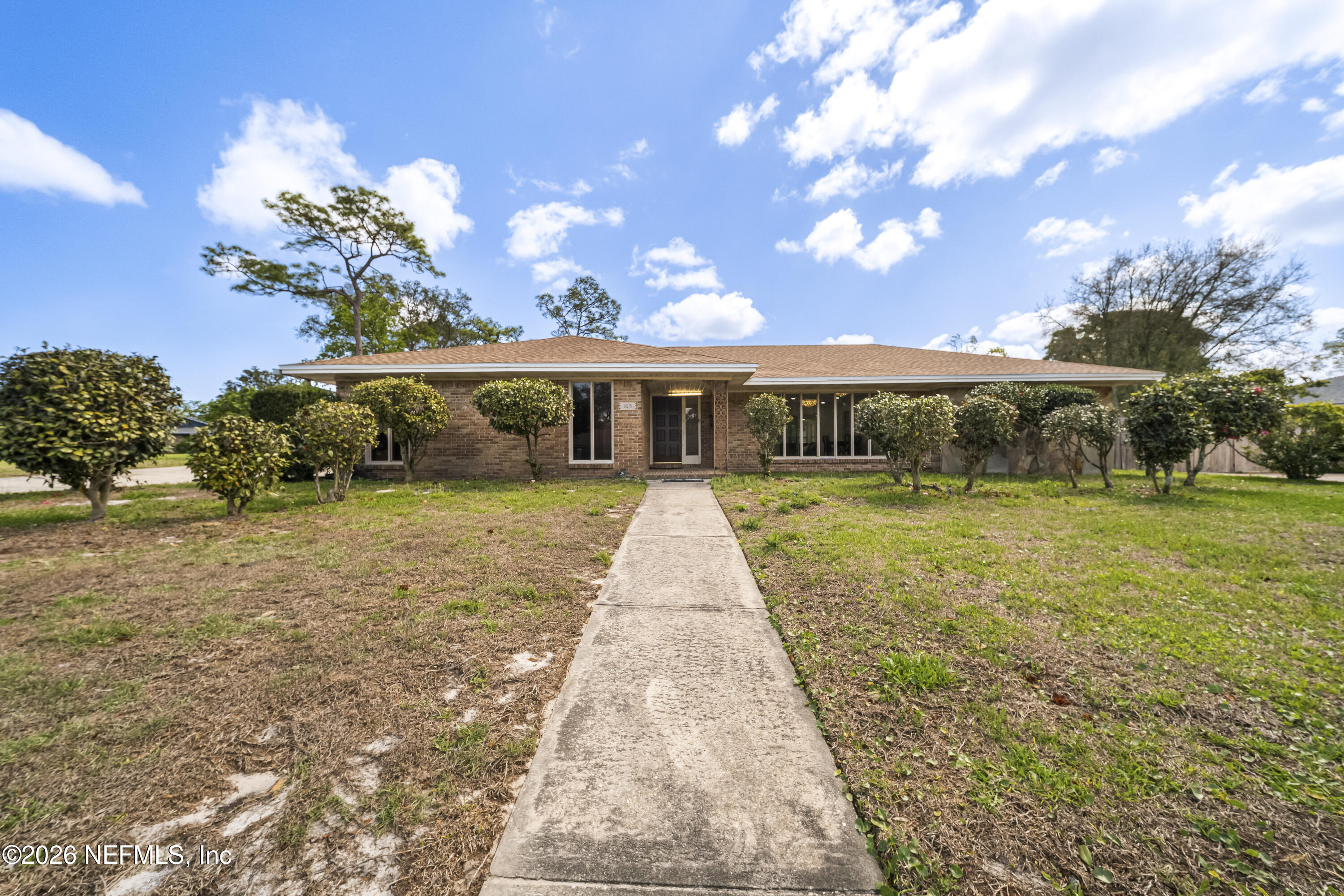 3571 Sandburg Road Jacksonville, FL 32277 - Photo 1 of 41 a front view of house with garden