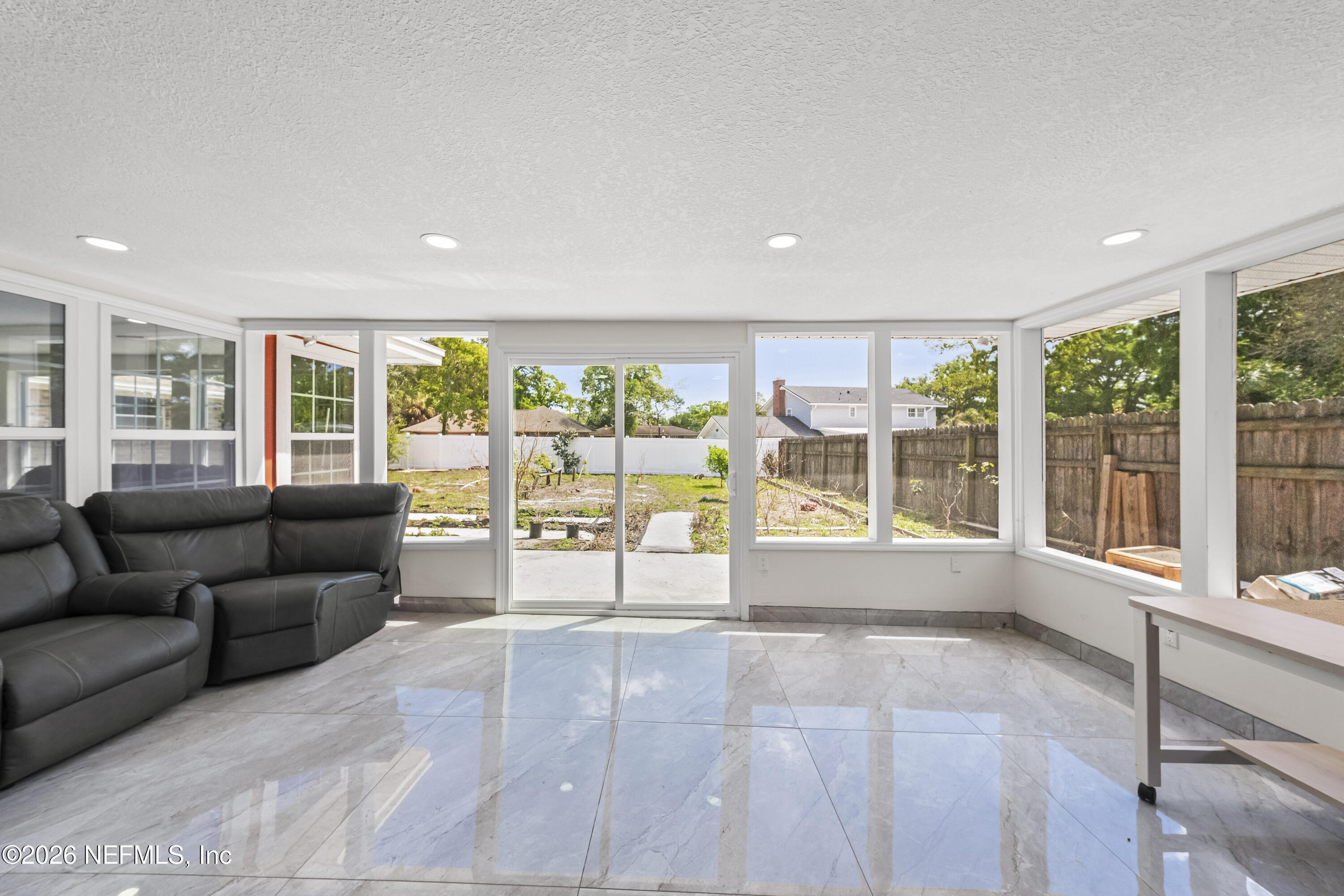 3571 Sandburg Road Jacksonville, FL 32277 - Photo 15 of 41 a living room with furniture and large windows
