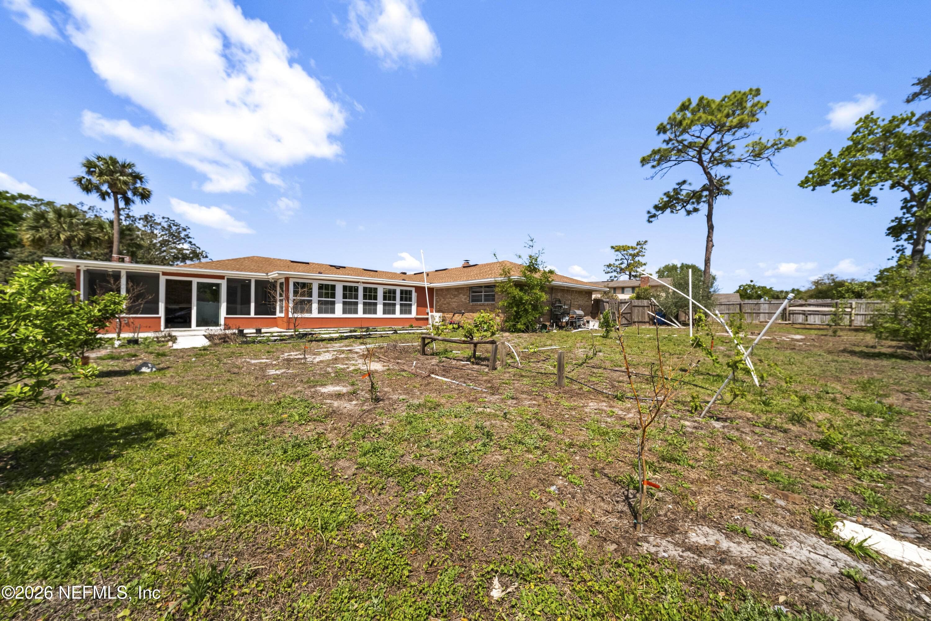 3571 Sandburg Road Jacksonville, FL 32277 - Photo 19 of 41 a front view of a house with a big yard