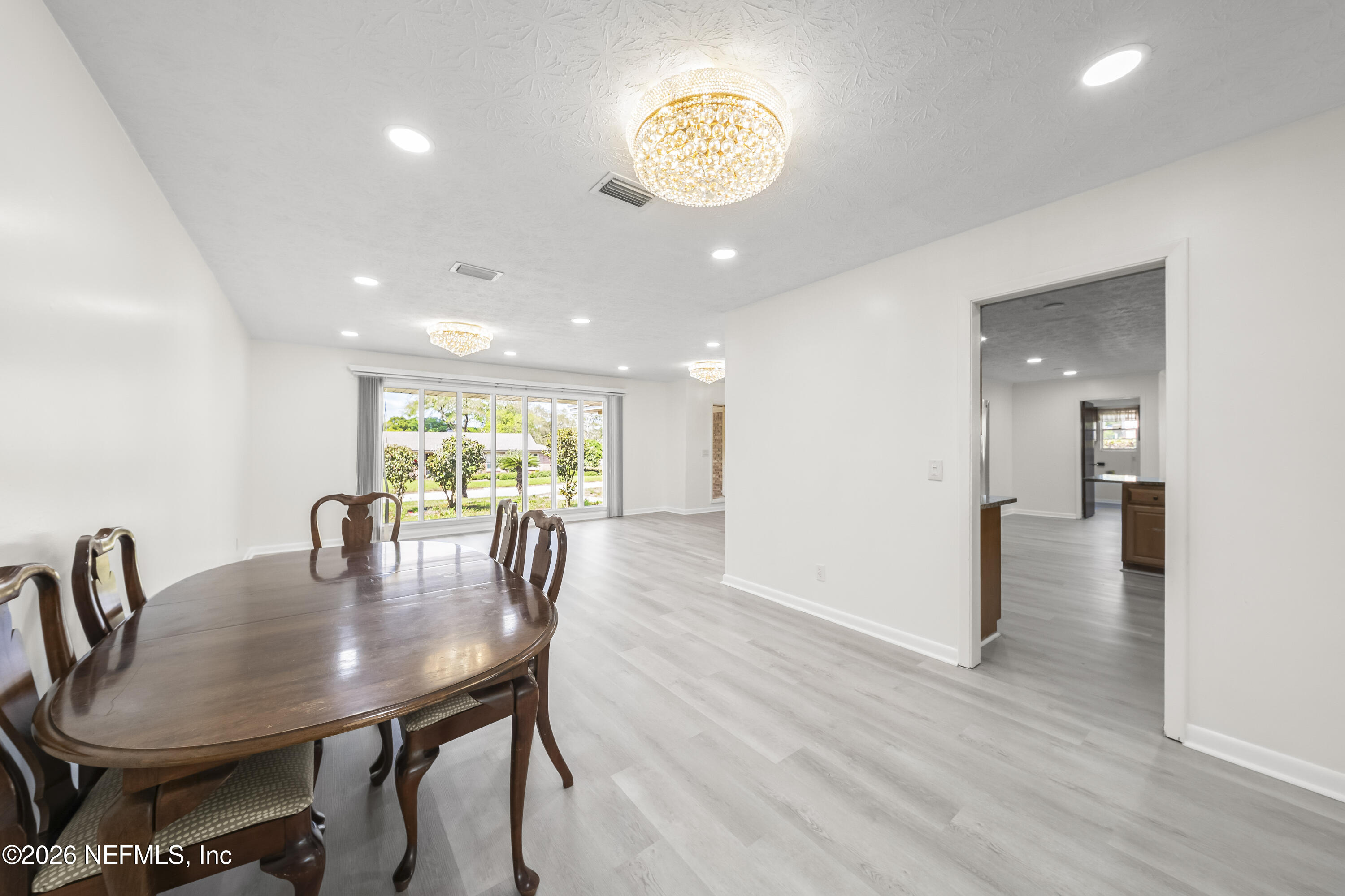 3571 Sandburg Road Jacksonville, FL 32277 - Photo 21 of 41 a view of a dining room with furniture window and wooden floor