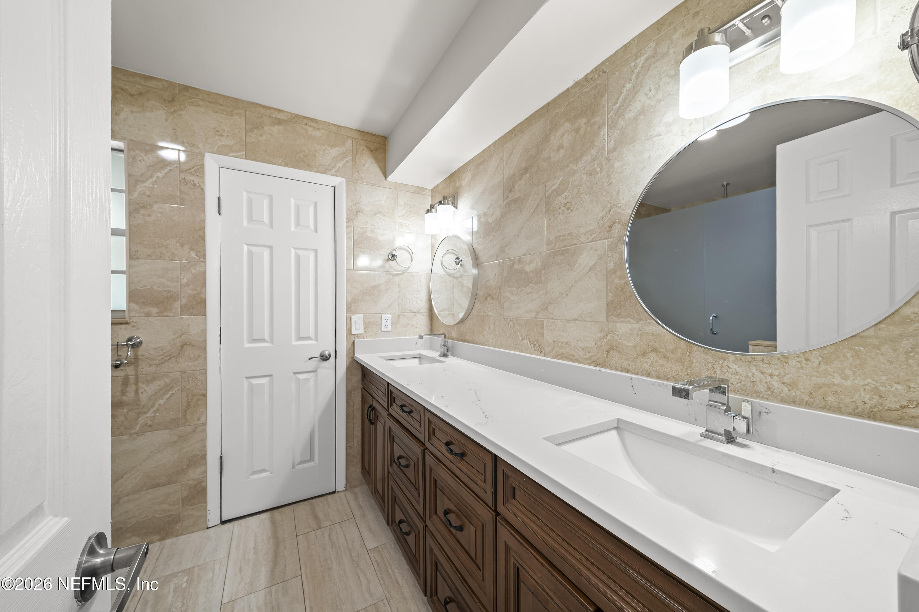 3571 Sandburg Road Jacksonville, FL 32277 - Photo 25 of 41 a spacious bathroom with a double vanity sink mirror and