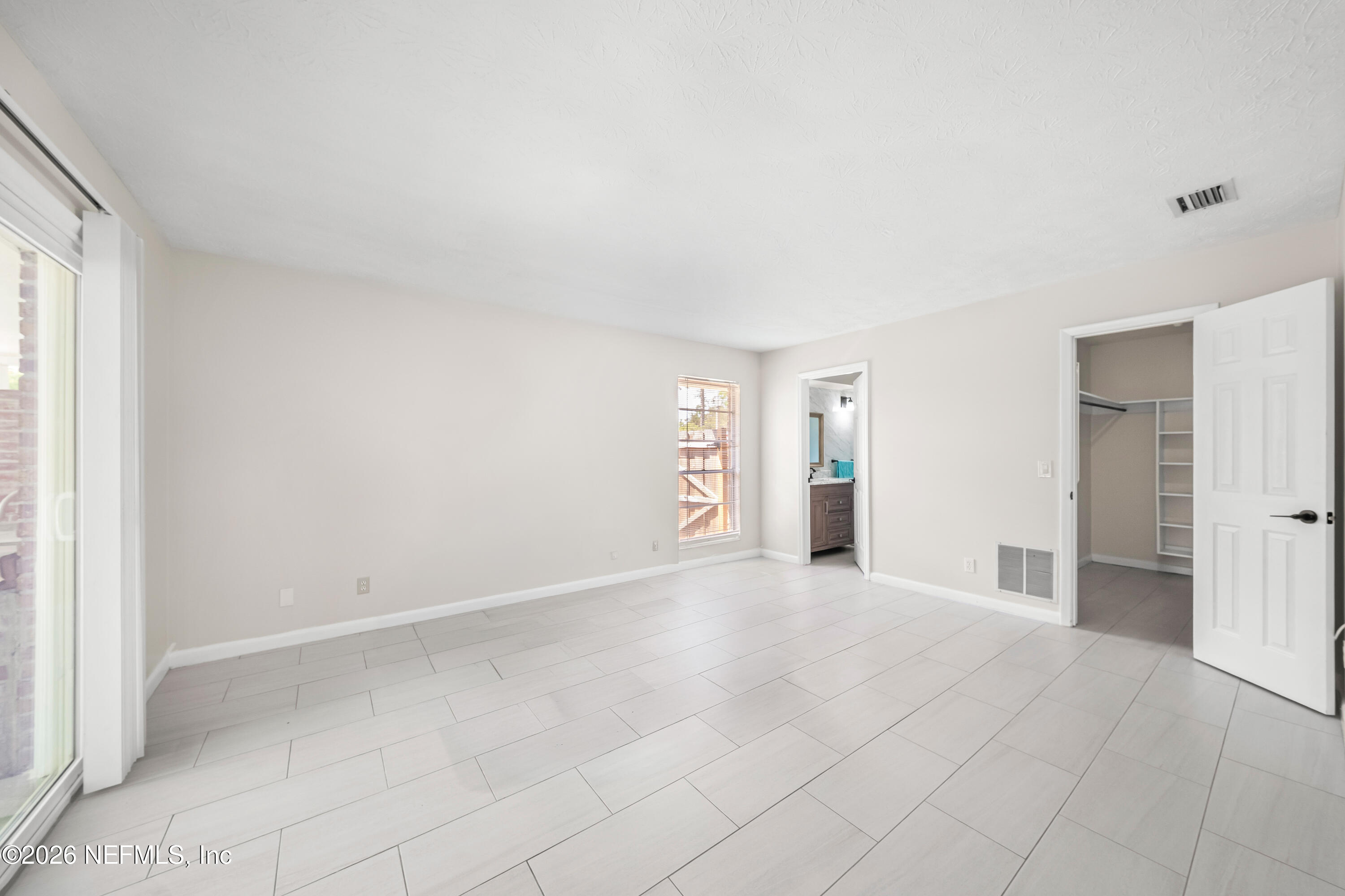 3571 Sandburg Road Jacksonville, FL 32277 - Photo 29 of 41 a view of empty room with wooden floor