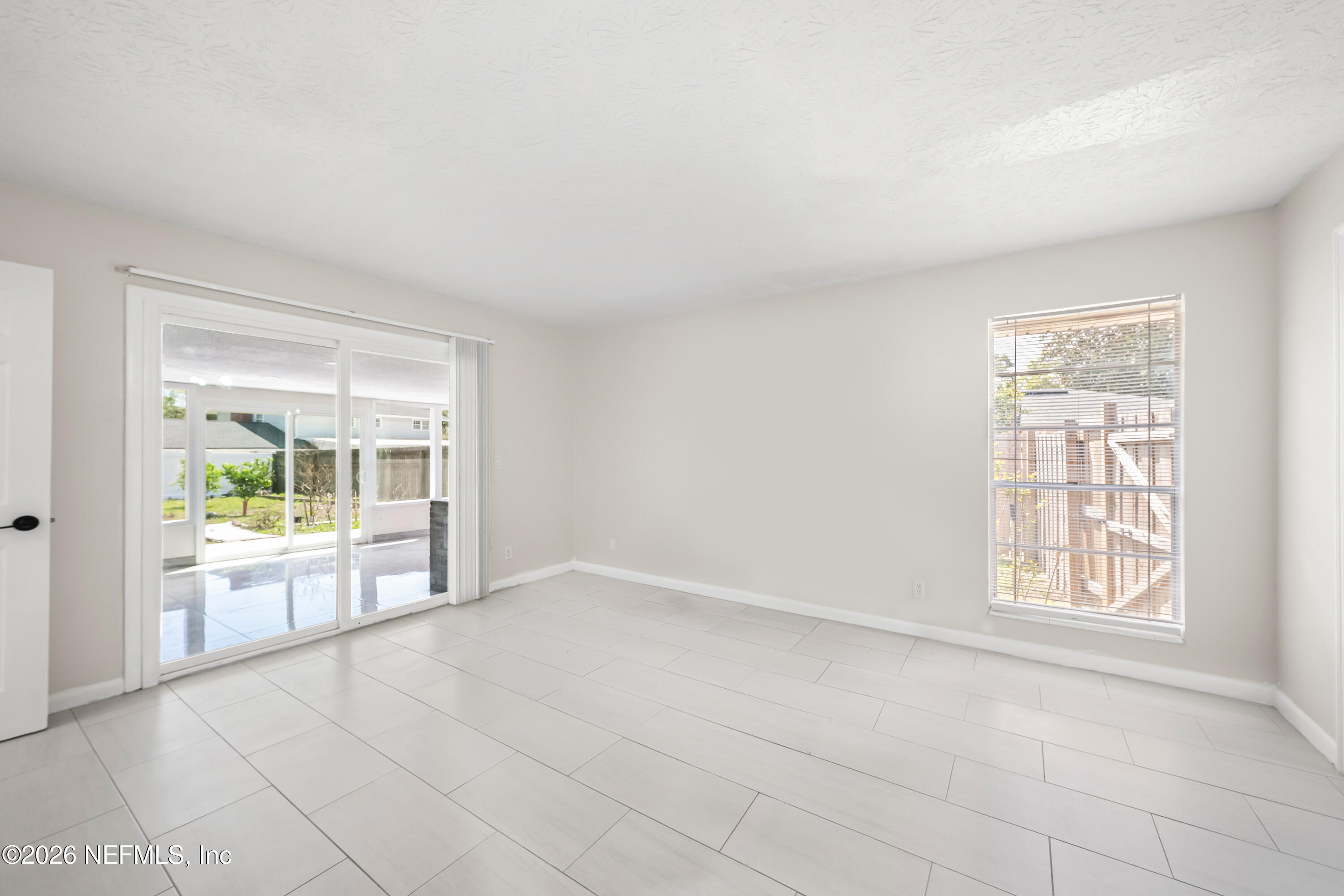 3571 Sandburg Road Jacksonville, FL 32277 - Photo 34 of 41 an empty room with windows