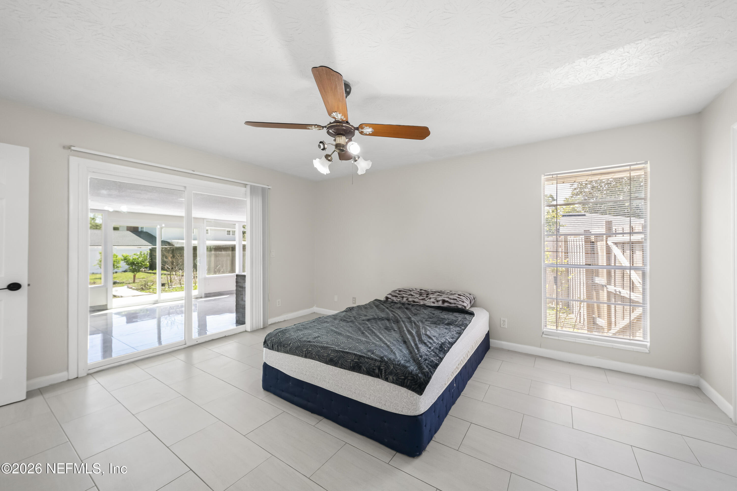 3571 Sandburg Road Jacksonville, FL 32277 - Photo 35 of 41 a living room with furniture and a table
