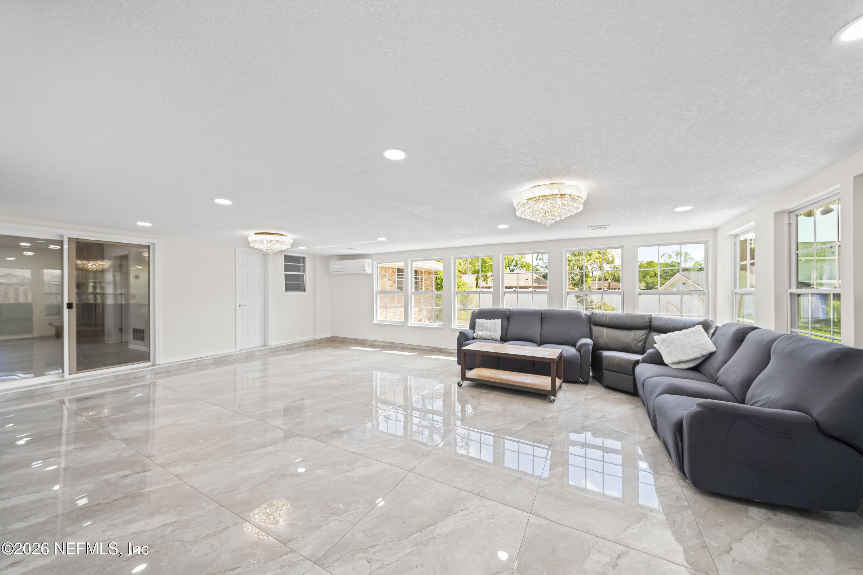 3571 Sandburg Road Jacksonville, FL 32277 - Photo 36 of 41 a living room with furniture and a large window
