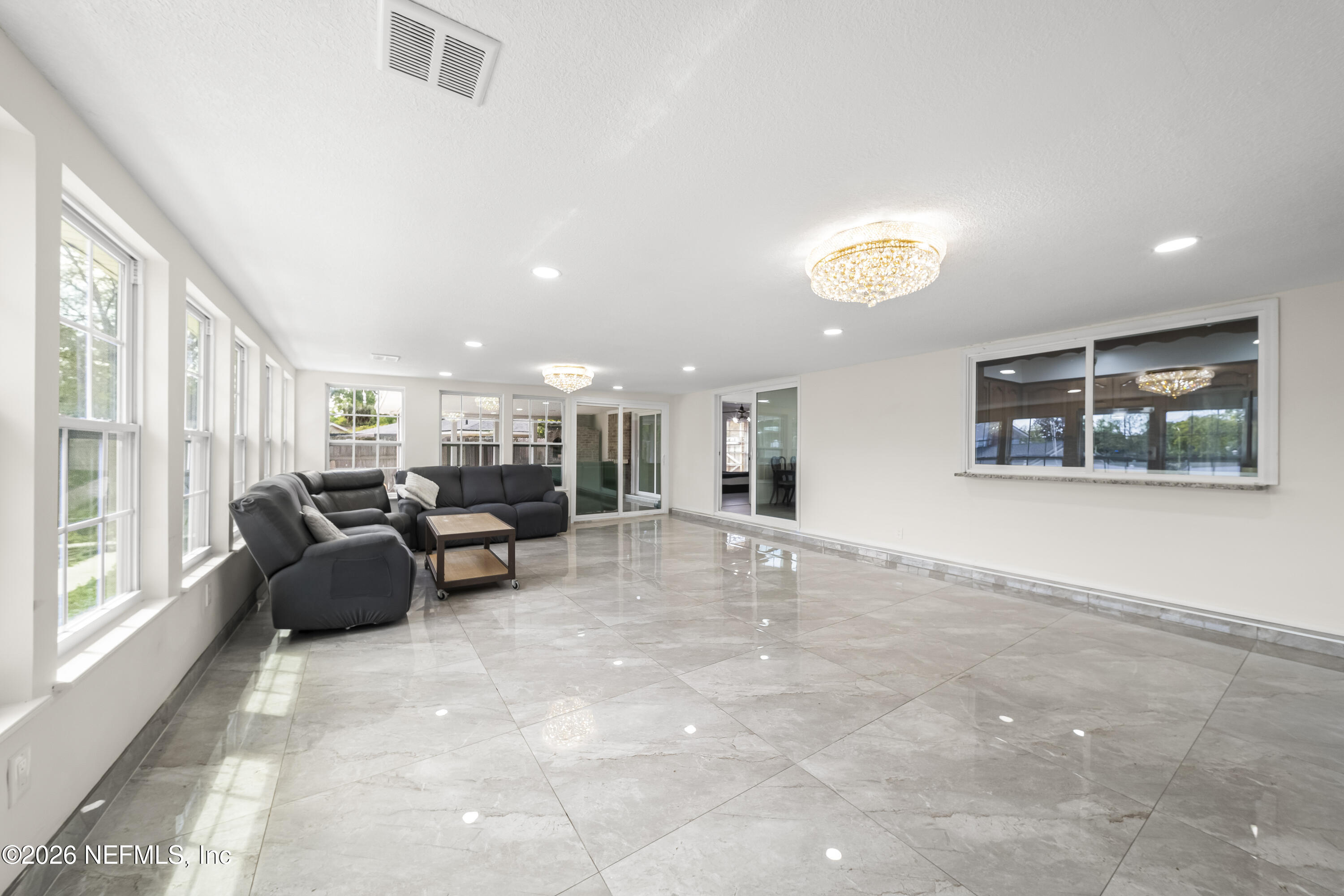 3571 Sandburg Road Jacksonville, FL 32277 - Photo 38 of 41 a living room with furniture and a large window