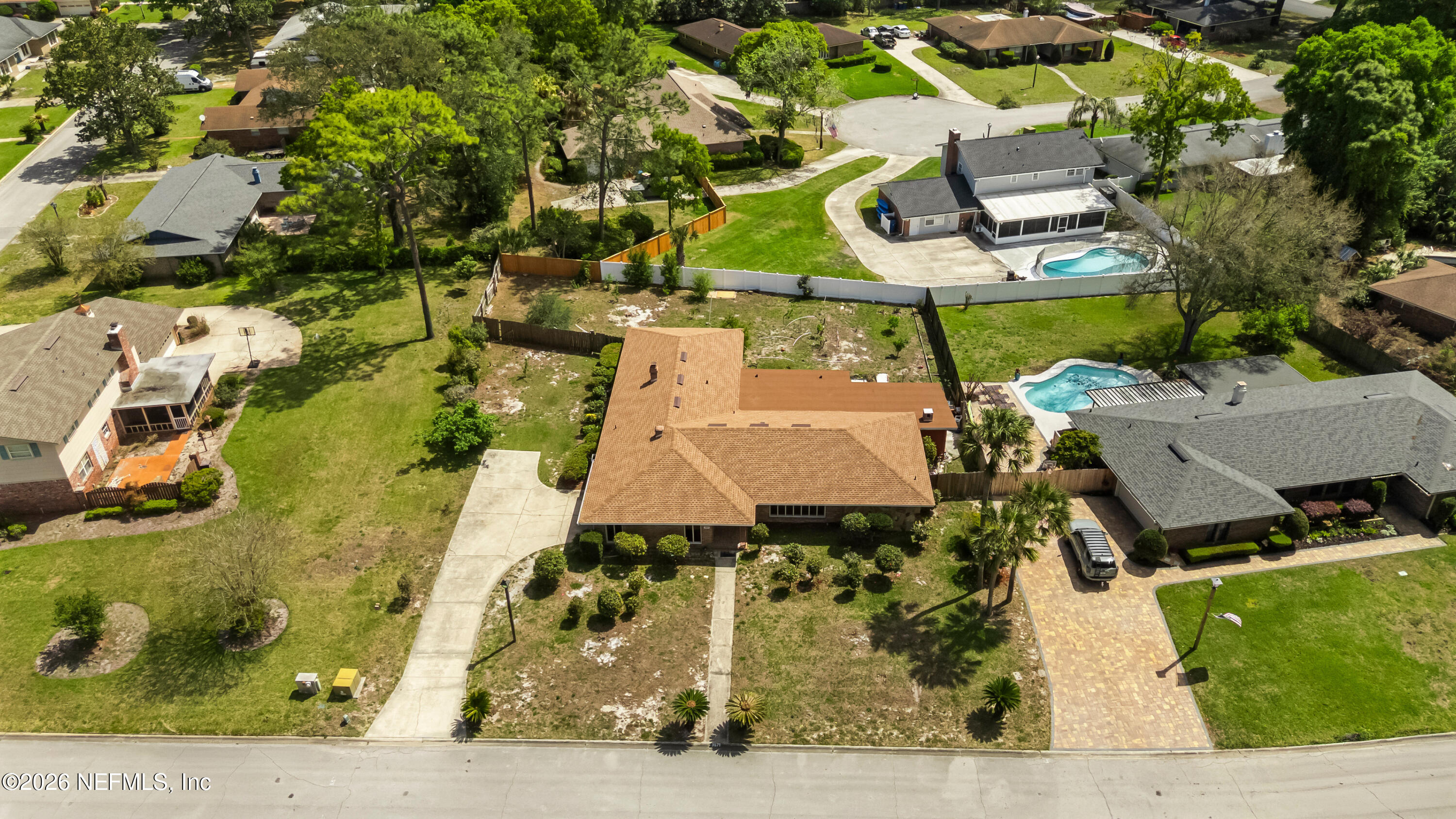 3571 Sandburg Road Jacksonville, FL 32277 - Photo 5 of 41 an aerial view of a house with swimming pool