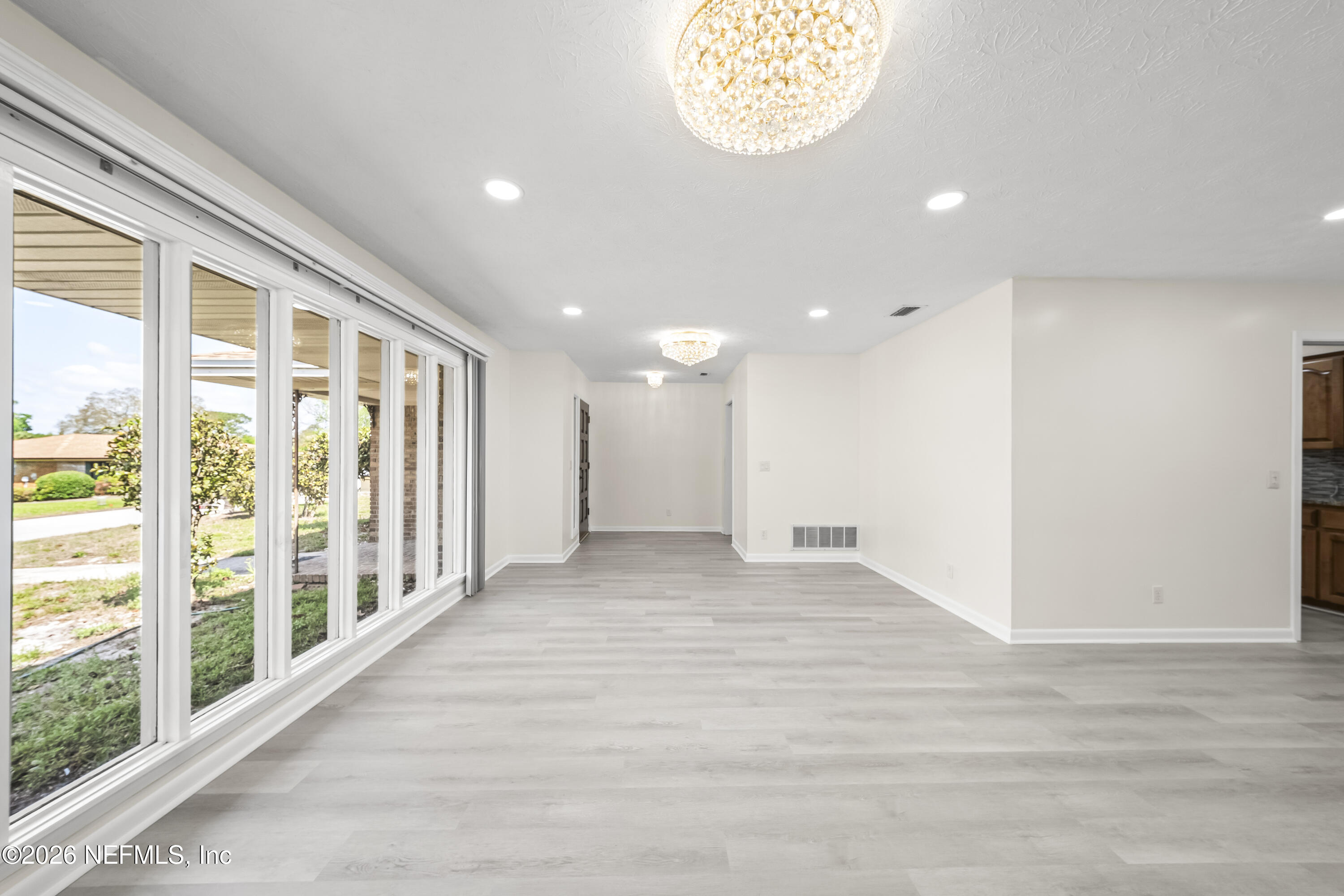 3571 Sandburg Road Jacksonville, FL 32277 - Photo 6 of 41 a view of an empty room with a window