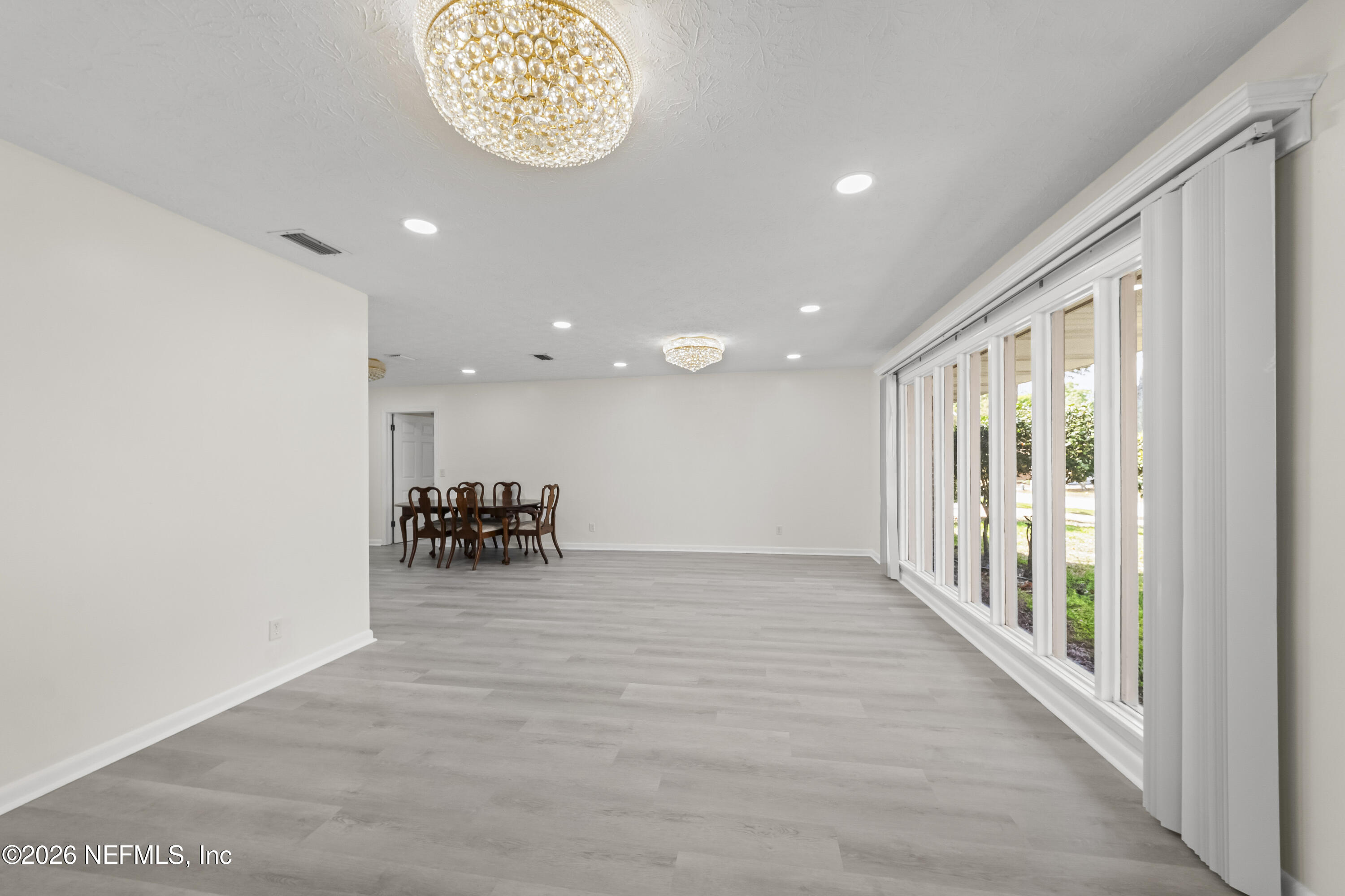 3571 Sandburg Road Jacksonville, FL 32277 - Photo 7 of 41 a view of an empty room with a window