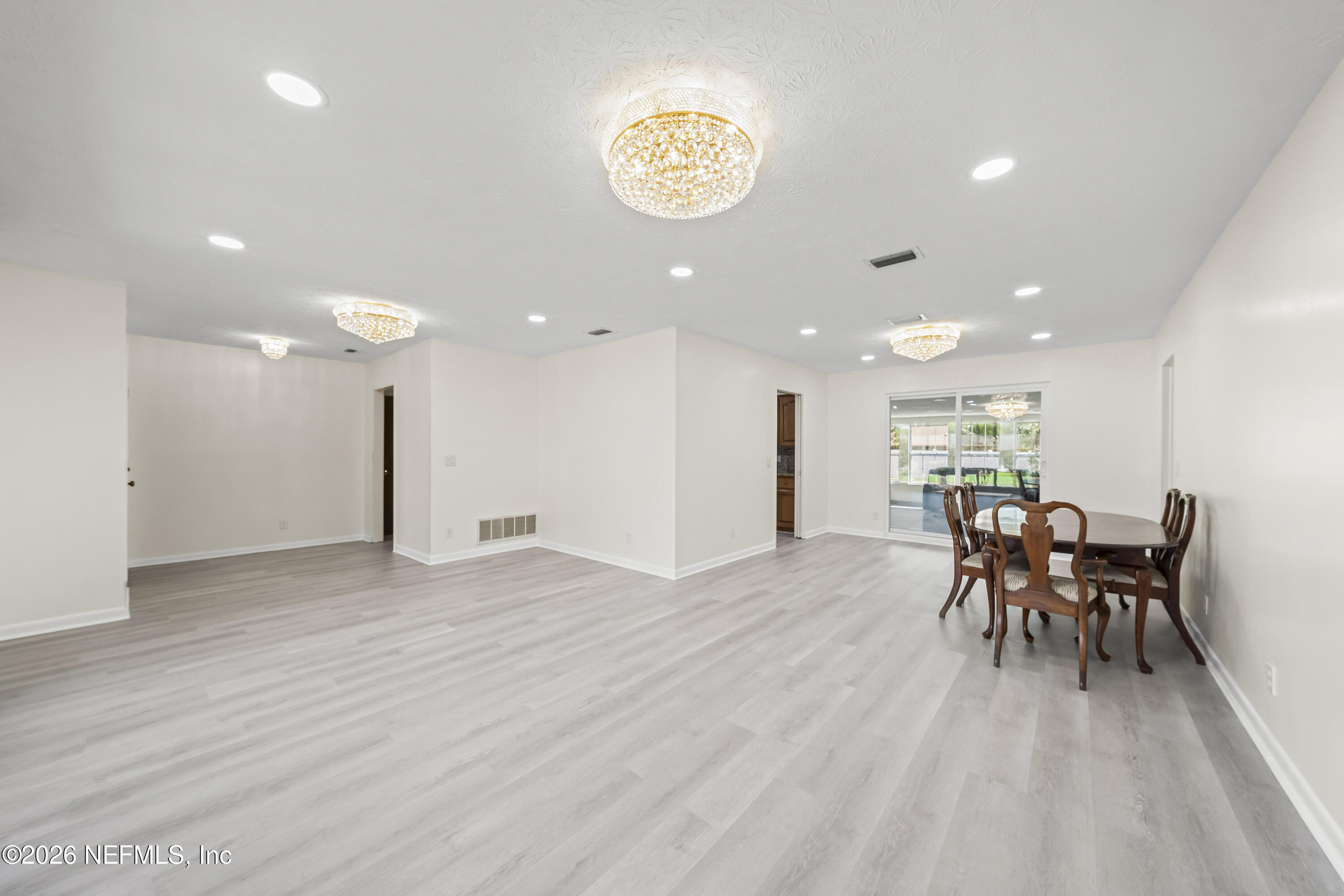 3571 Sandburg Road Jacksonville, FL 32277 - Photo 9 of 41 a view of a dining room with furniture